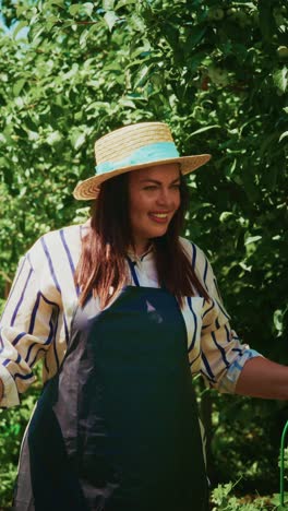 A Cheerful Gardener in Striped Shirt and Straw Hat Tending to the Lush Greenery, Embracing Nature while Inviting Community Connection through Gardening Skills