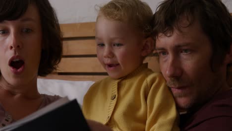 Close-up-view-of-family-in-bedroom-at-home