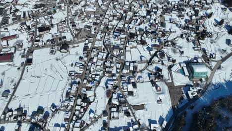 establishing pull away shot of japans nozawaonsen mountain ski resort village