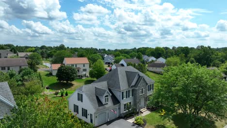 large house in american neighborhood on summer day