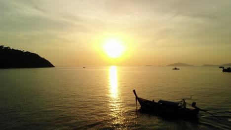 flight following a tale boat with golden sunset on the background