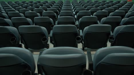 Empty-rows-of-seats-in-massive-sports-stadium,-static-view