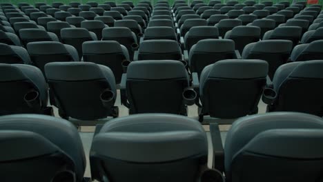 empty rows of seats in massive sports stadium, static view