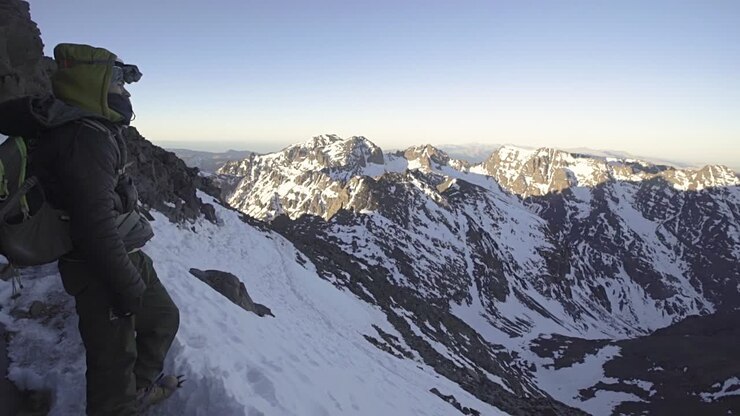 Hiker Overlooking Mountains