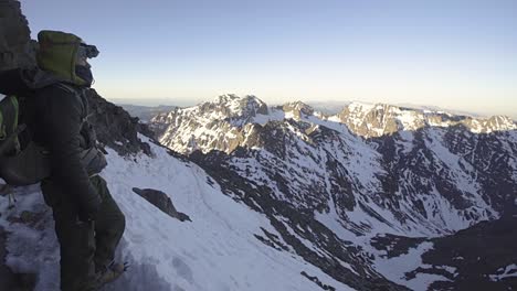 hiker overlooking mountains