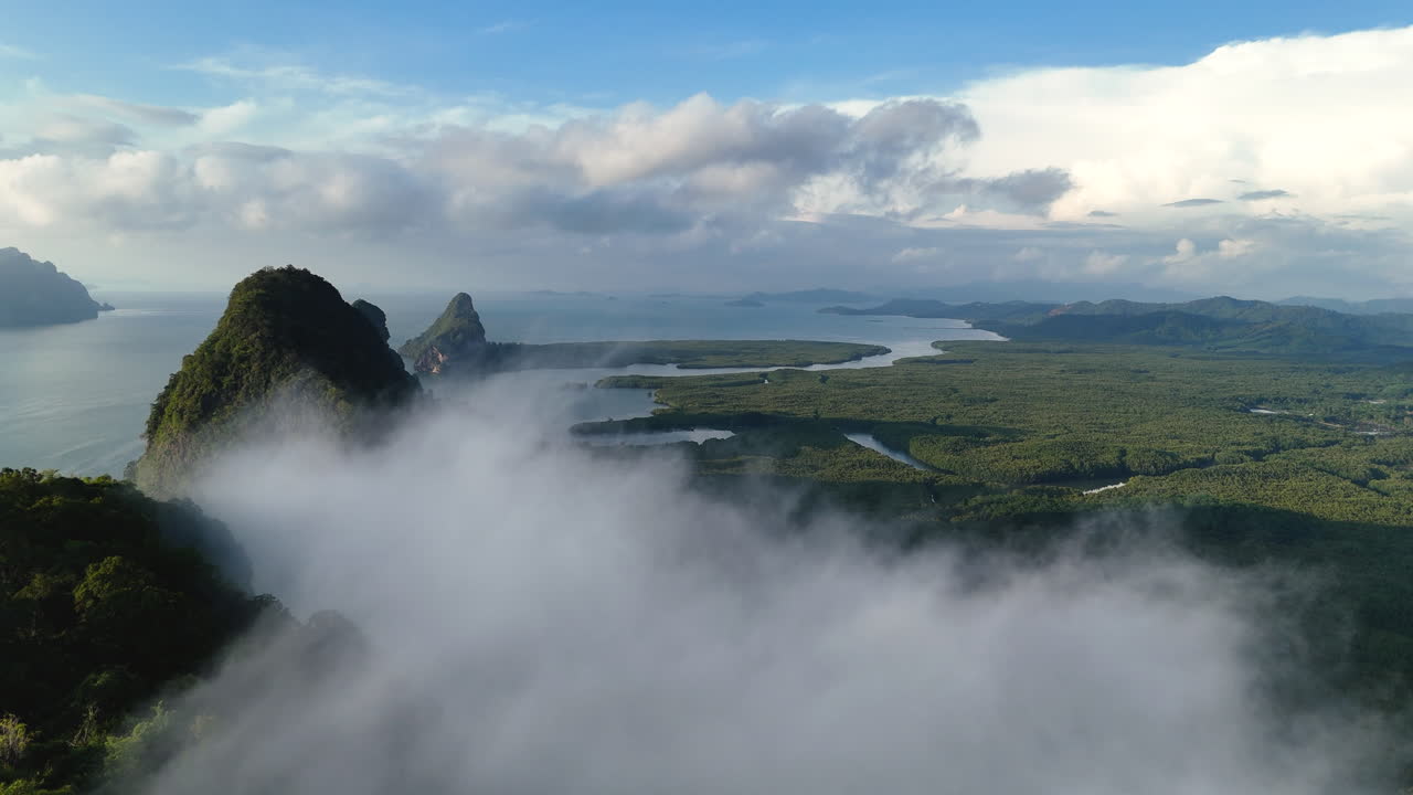 Clouds And Fog On The Limestone Islands In Phang Nga Bay In Summer In Thailand. - aerial shot
