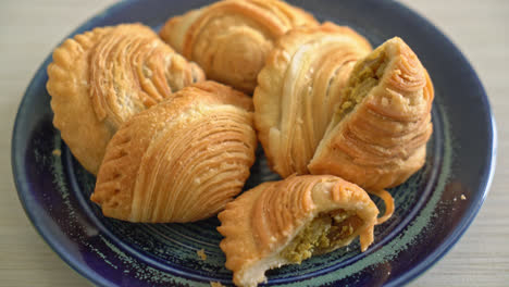 curry puff pastry stuffed chicken on plate