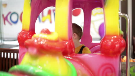 boy in amusement train