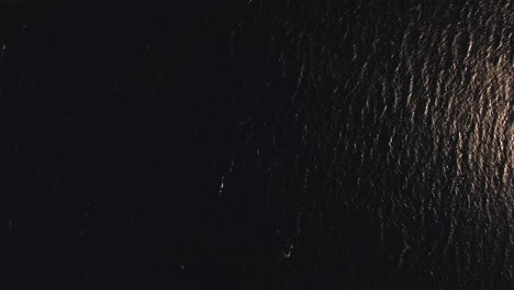 aerial shot of sea and trikorfo beach coastline with houses greece