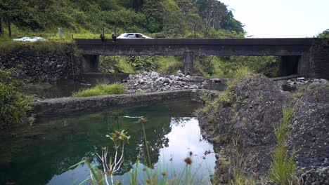 scenic bridge over a calm river in lush green countryside