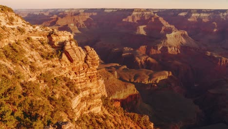 scenic and cinematic sunrise and sunset time-lapse at the famous grand canyon national park and its vibrant red rocks in arizona, utah, america usa with sky, clouds and sunshine in the desert landscape. cinemagraph seamless video.