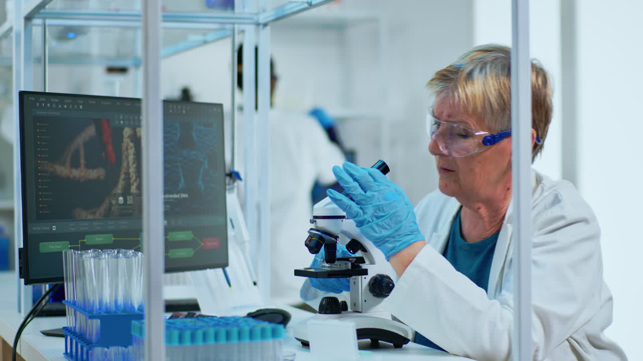 Elderly biotechnology scientist researching in the laboratory