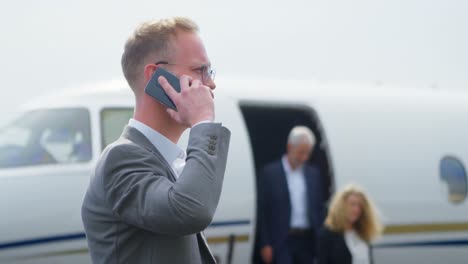 businessman talking on mobile phone at terminal 4k