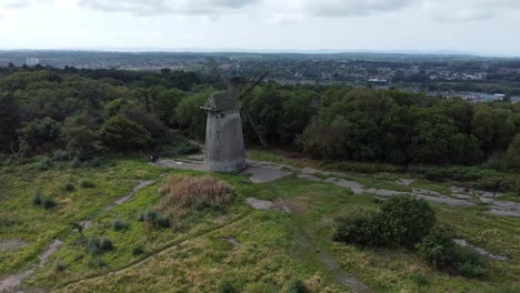 bidston hill disused rural flour mill restored traditional wooden sail windmill birkenhead aerial view wide orbit left