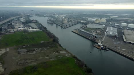 usa, ca, stockton, port, 2024-12-28 - drone view of the port of stockton with a ship, a crane, and many industrial buildings.