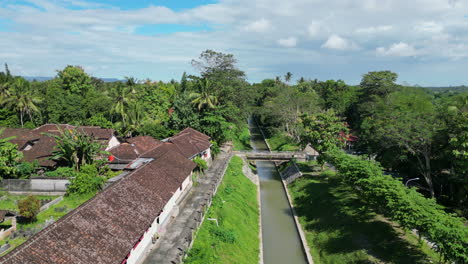 rural canal fly over on outskirts of yogyakarta indonesia