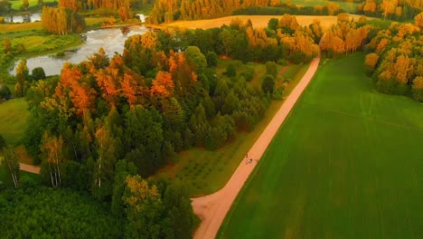 colorful latvian countryside landscape in autumn with a dirt road