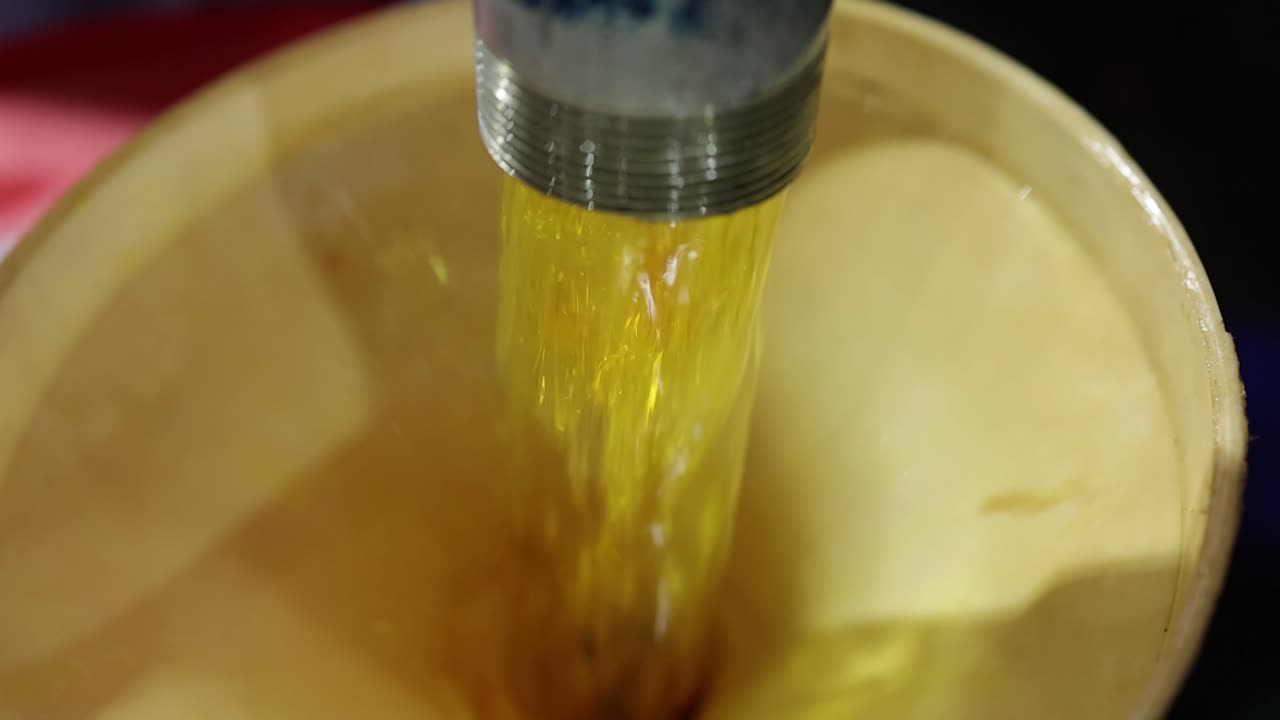 slow motion of lubricant oil has filtering process, industry 5.0