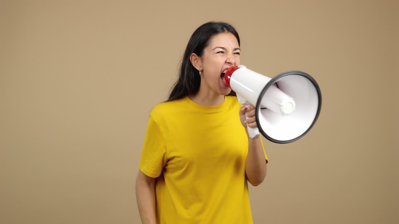Young Woman Shouting and Expressing Emotions with a Megaphone