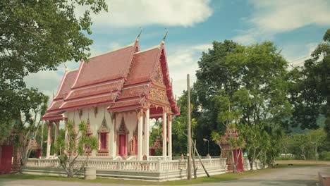 beautiful thai temple in thailand in a natural setting with blue sky