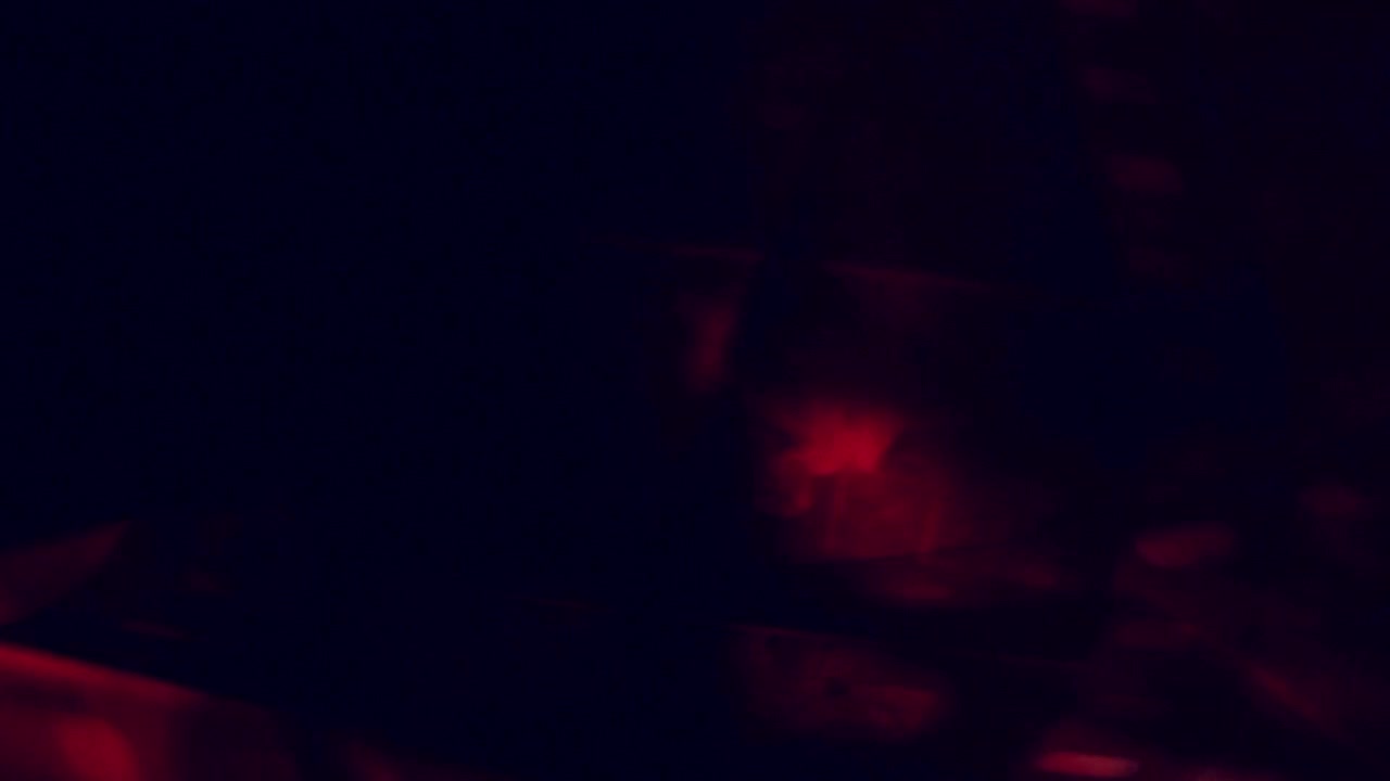 Dynamic Red and Orange Light Leaks on Dark Background