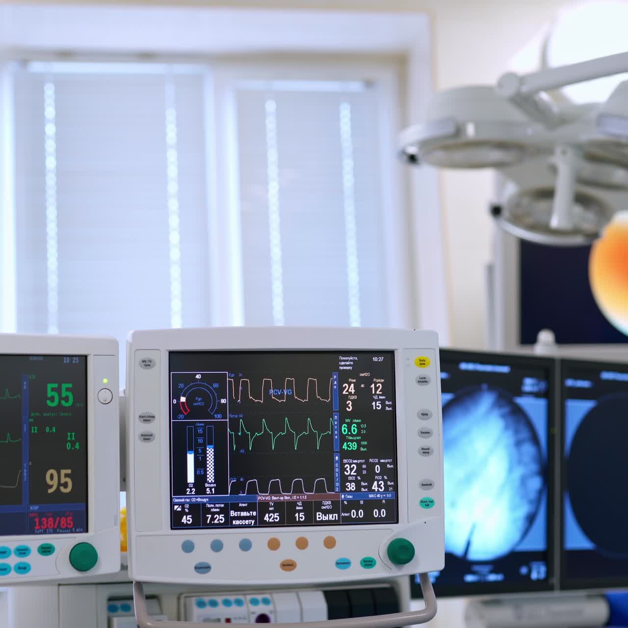 Modern medical equipment in the intensive care in clinic. Two monitors showing patient's condition during the operation. Coronavirus, COVID-19, 2019-nCoV concept.