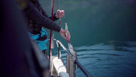 fisherman put the fishes back in the river in norway