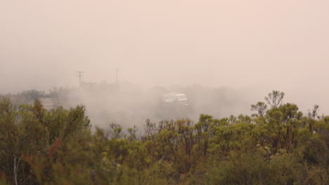 Footage-of-a-camper-van-being-smoke-encircled-in-the-Hemet-wildfires-in-California's-Riverside-County,-where-two-people-lost-their-lives