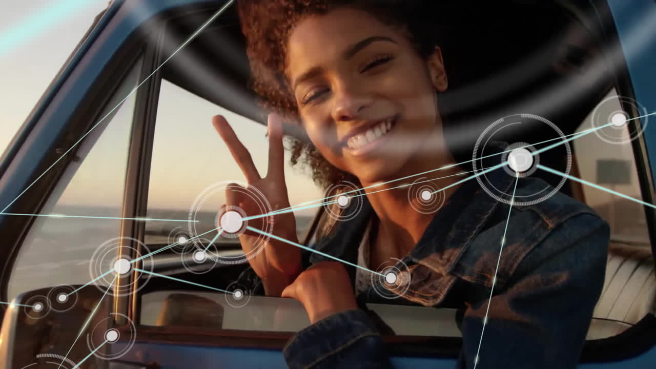 Animation of network of connections with icons over diverse couple in car by sea