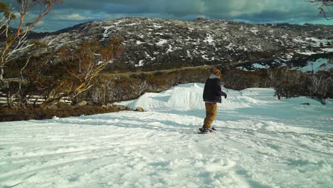 Dolly-jib-Outback-Snowboarder-hitting-Jump-at-Perisher-Australia-one-foot-jump-by-Taylor-Brant-Film