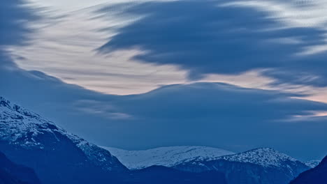 Timelapse-video-of-beautiful-snowcapped-mountains-and-beautiful-moving-clouds-in-Aurland,-Sogn-And-Fjordane-Fjord,-Norway