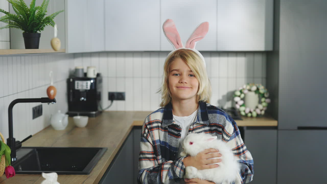 Boy Holding Easter Rabbit in Kitchen