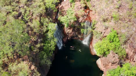 tourist at florence falls in litchfield national park, northern territory, australia