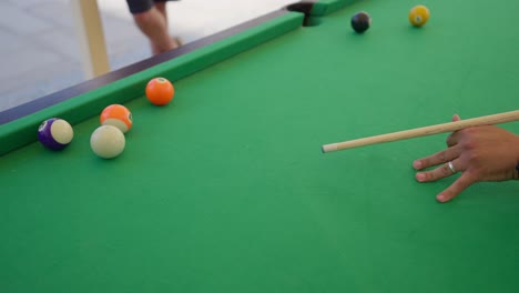 billiard-competition-between-Young-men-in-the-hall-insert-shot,-trucking-shot