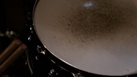 close up of a drummer playing on a snare