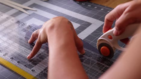 hispanic artisan handcrafting leather collars in her workshop