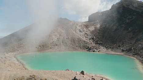 emerald crater lake in a volcanic landscape