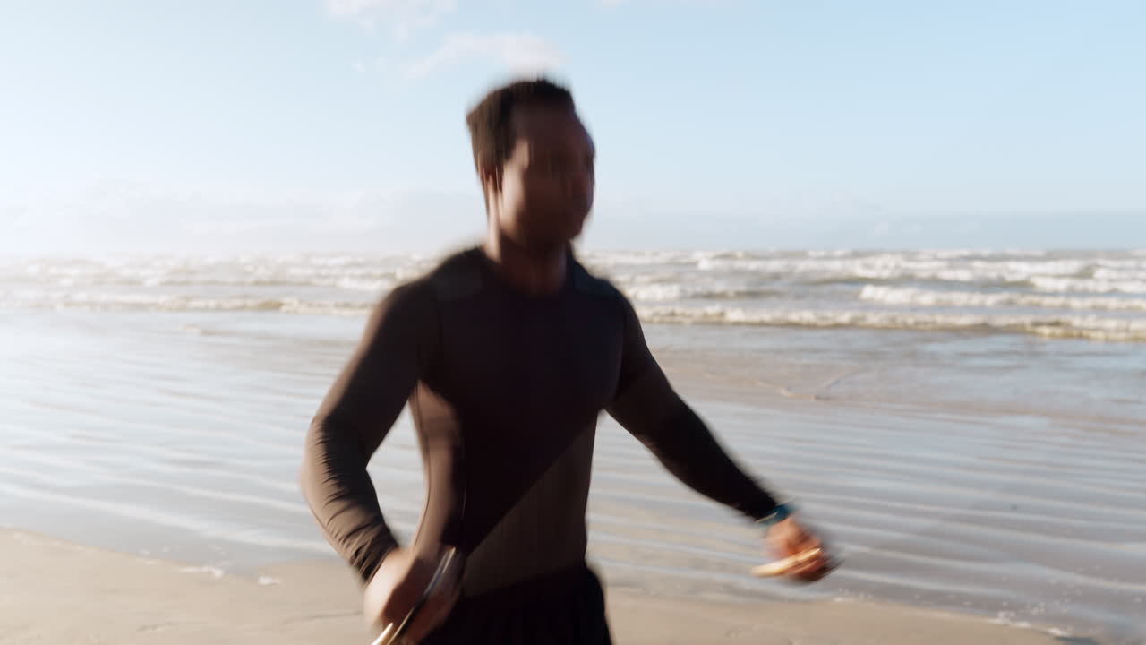 Black man, fitness and skipping rope on beach