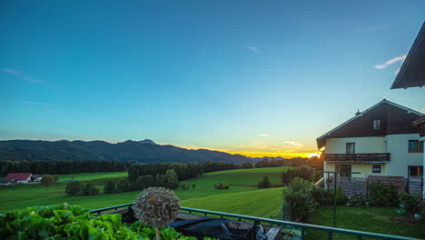 timelapse of a beautiful sunset from a balcony in a rural landscape