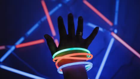 hand with glow sticks