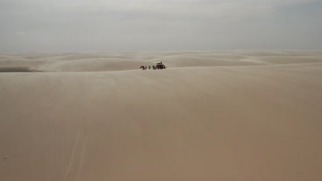 Aerial:-Kitesurfing-in-the-dunes-of-Lencois-Maranhenses,-Northern-Brazil