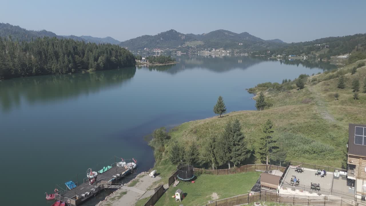 Colibița Lake in Rumania. Filmed with dron DJI mini 4 pro in D-Cinelike 4k. Movement over lake