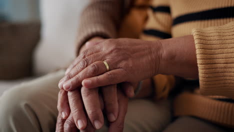 senior, couple and hands for empathy on sofa