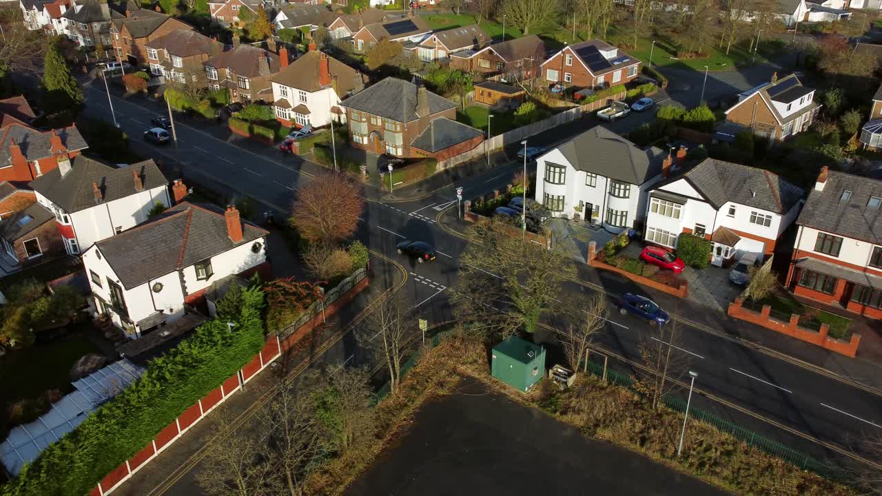 Establishing aerial view expensive British middle class houses in rural suburban neighbourhood