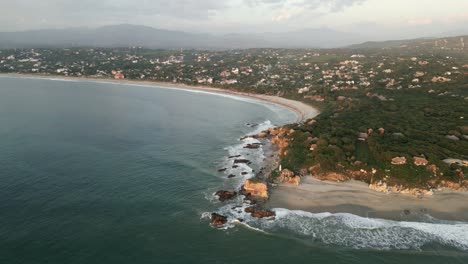 aerial high angle of la punta zicatela beach in oaxaca mexico puerto escondido at sunset