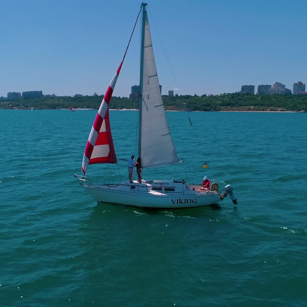 Yacht sailing in open sea. Yachting with sails up at windy day