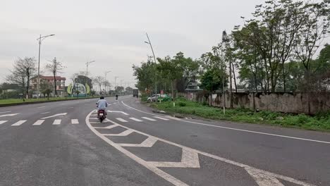 motorbike travels through a quiet urban street