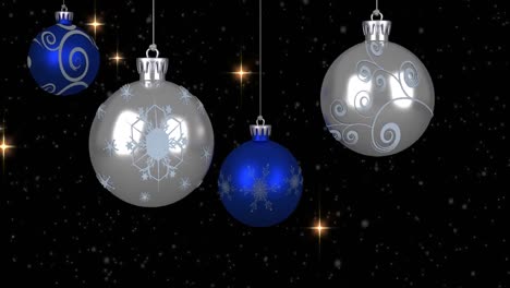 animation of christmas bubbles over stars and snow on black background