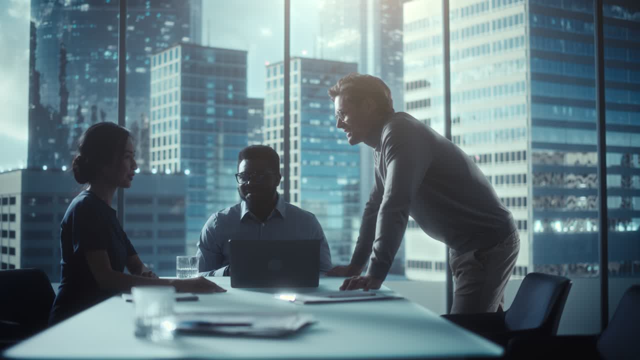 Multiethnic Diverse Office Conference Room Meeting: Team of Three Creative Entrepreneurs Talk, Discuss Growth Strategy. Stylish Young Businesspeople Work on Digital e-Commerce Startup Project.