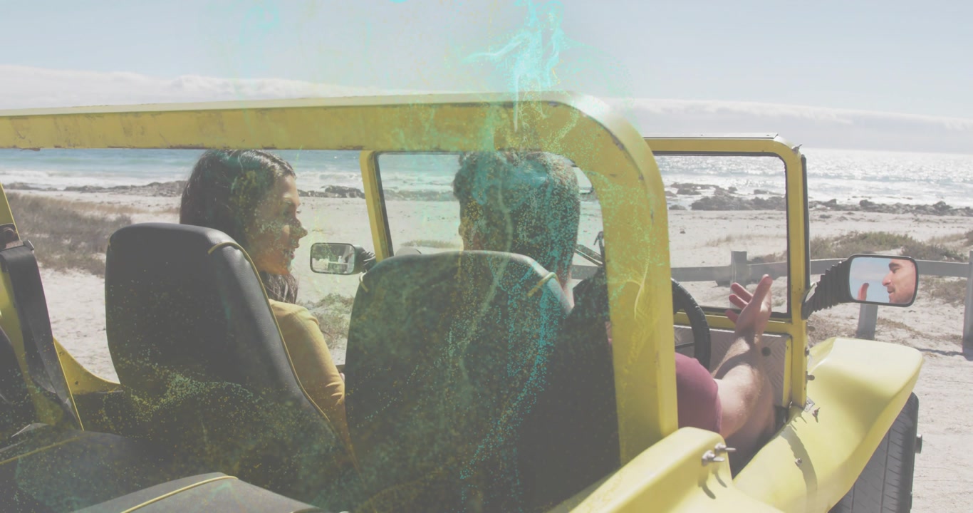 Female passenger speaking, male driver adjusting mirror and gazing at ocean to capture travel shot